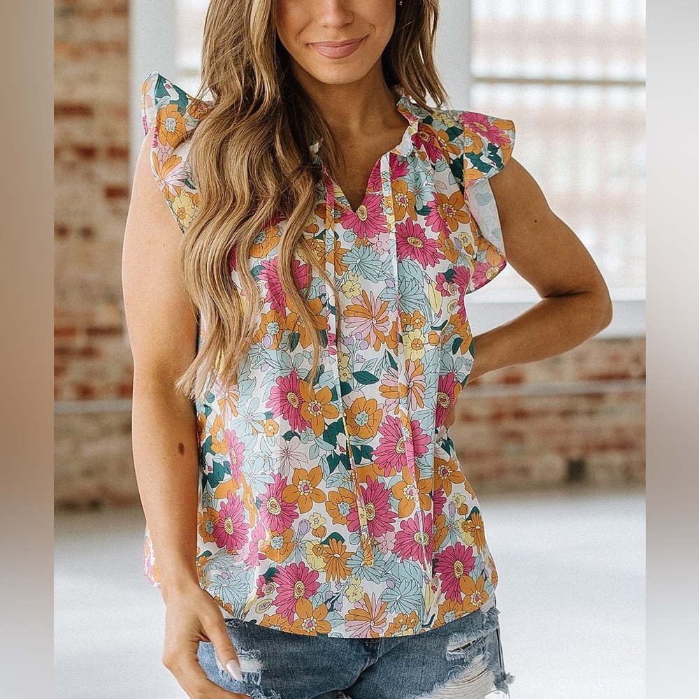 Sleeveless flutter top. Brand new, never worn. Light and breathable material.